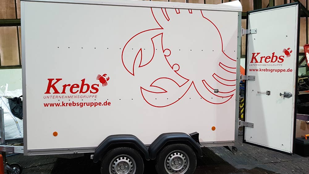 Werbung für die Krebs Gruppe und Warnowkran